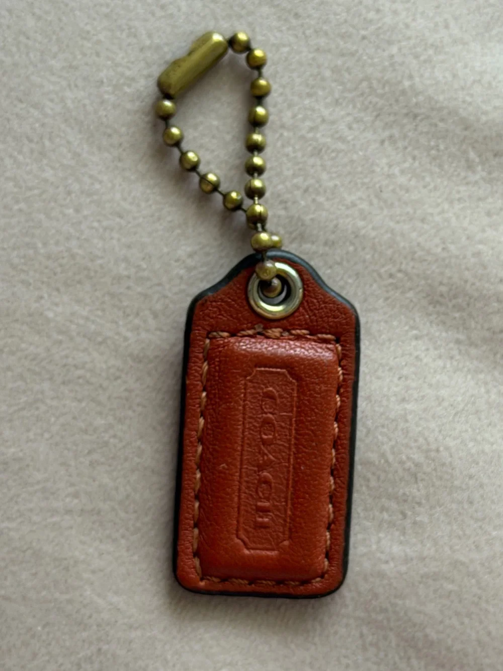 COACH Small Orange Leather Hangtag🧡
